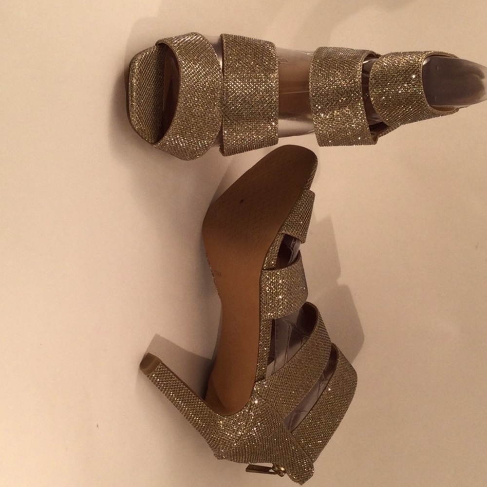 Strapped high heel sandals with sparkly gold mesh texture.